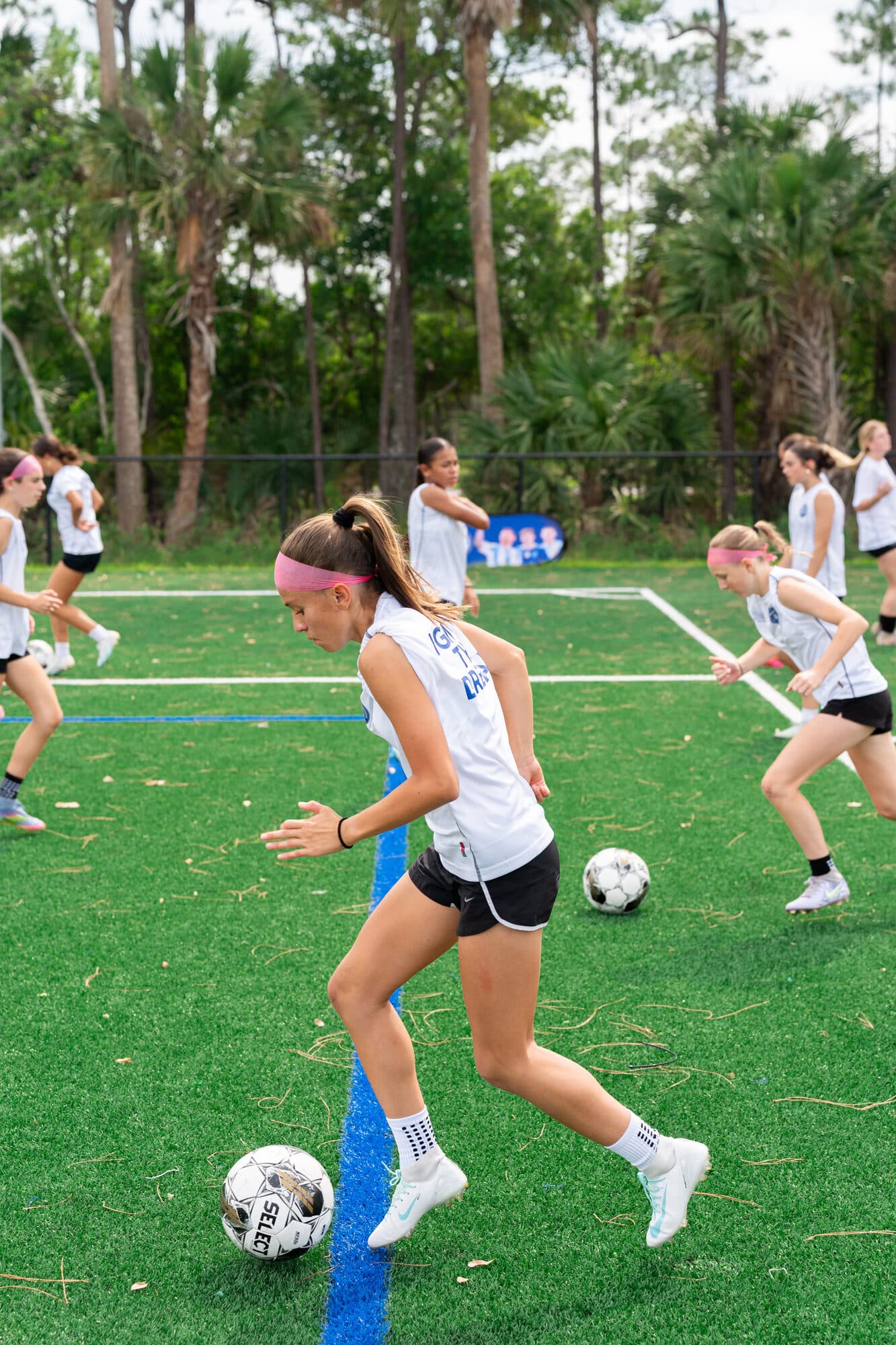 Players in an agility and dribbling drill