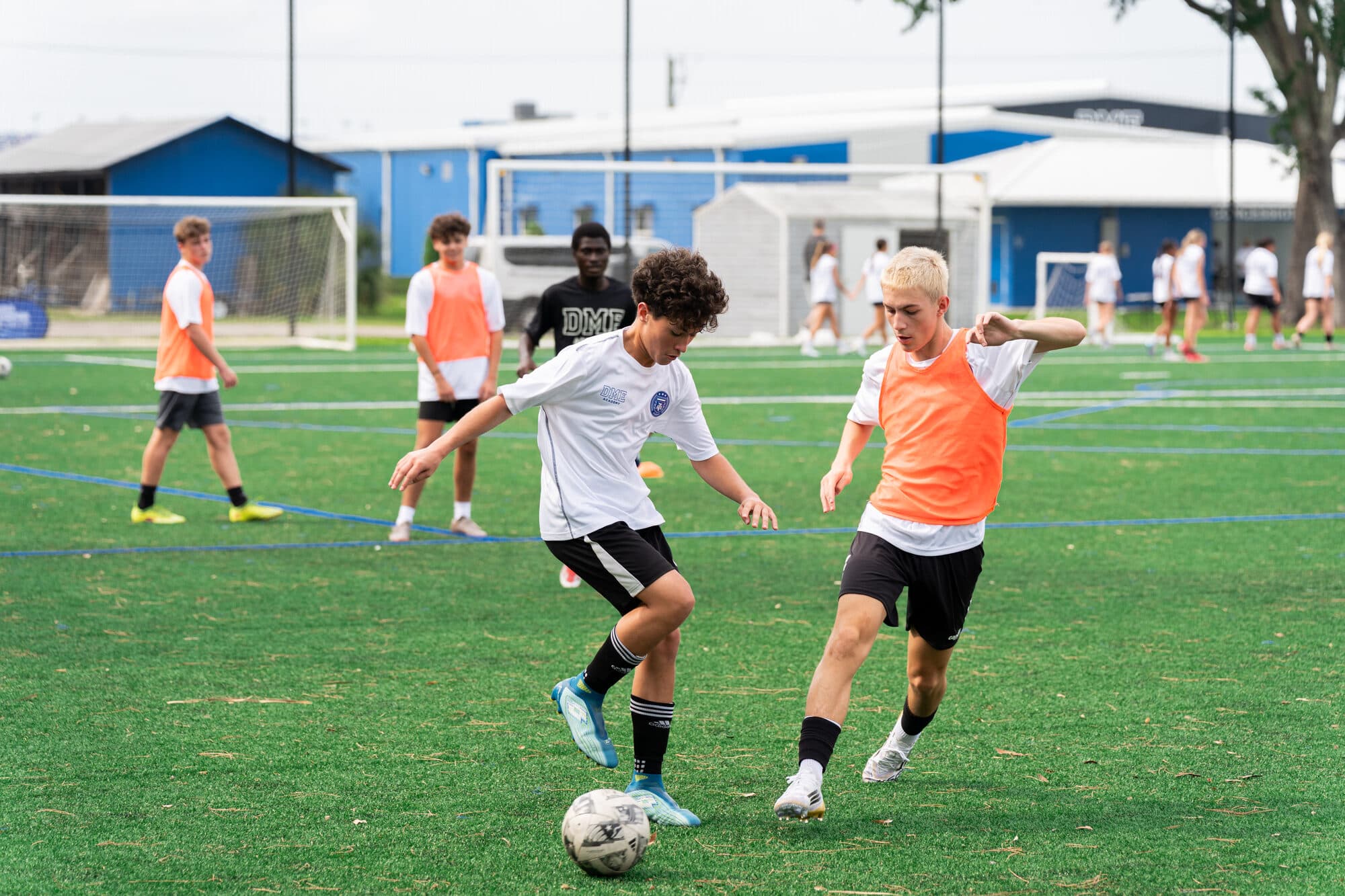 Two young players competing for the ball